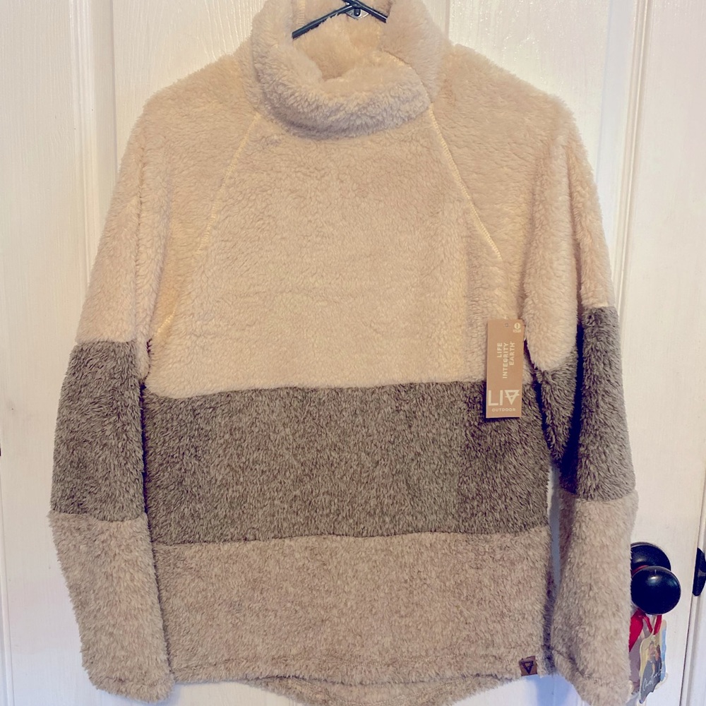 Gorgeous pullover. So soft! So warm! So stylish! New with tags! Size small